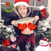 Miley Cyrus breasts exposed in Christmas photo (Free the Nipple)