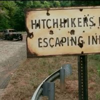 The Walking Dead road sign Hitchhikers may be escaping inmates
